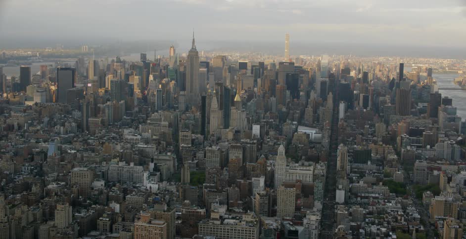 The city below has heavy clouds above