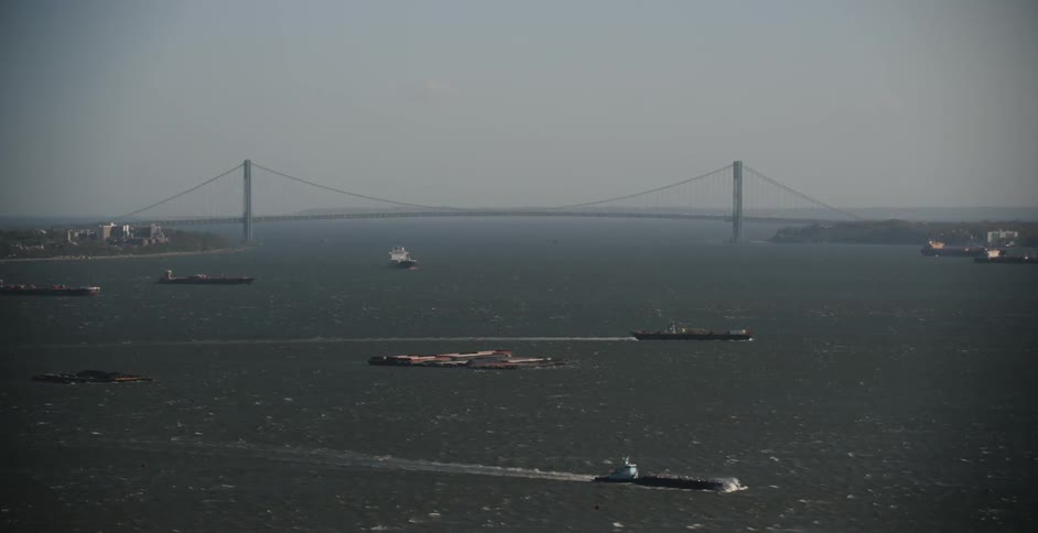 A river and a bridge are being filmed from the air