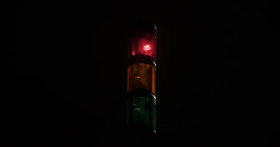 Traffic light flashes red and then turns green
