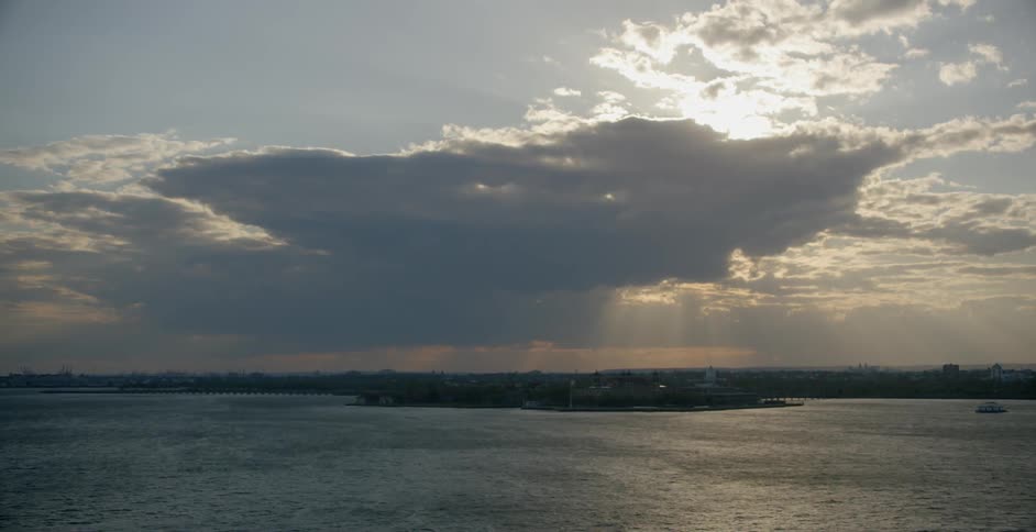 Clouds float over a large lake