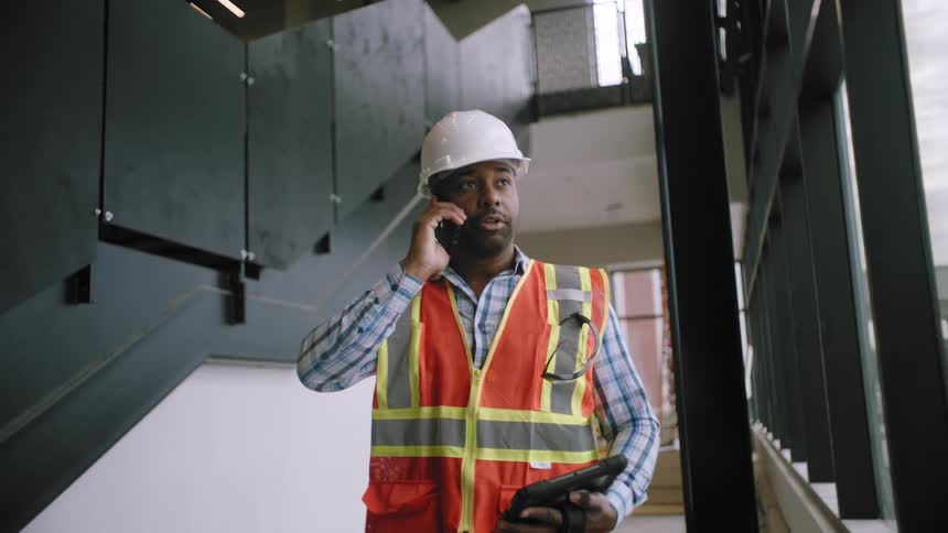 A man is talking on a cell phone