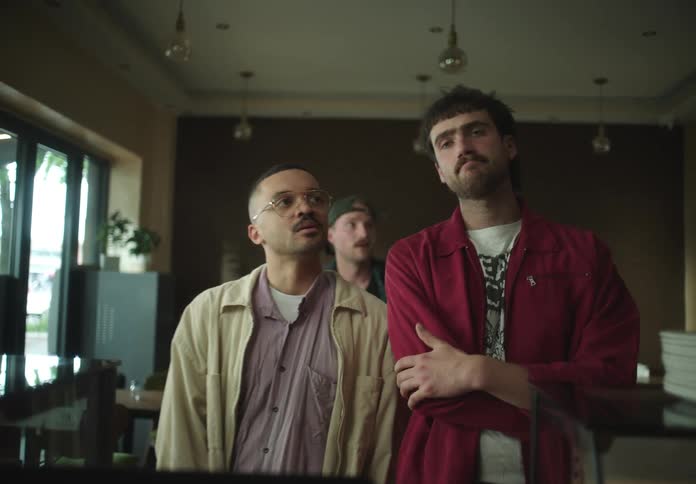 Men in a line at a restaurant