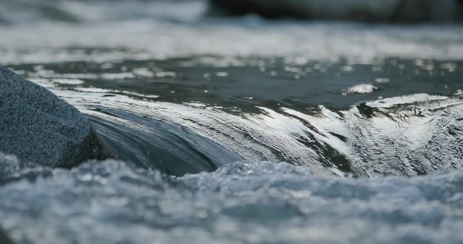 Water flowing through river rapids