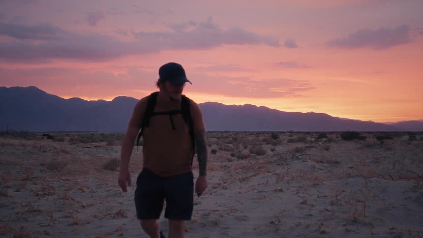 A backbacker walking in the desert