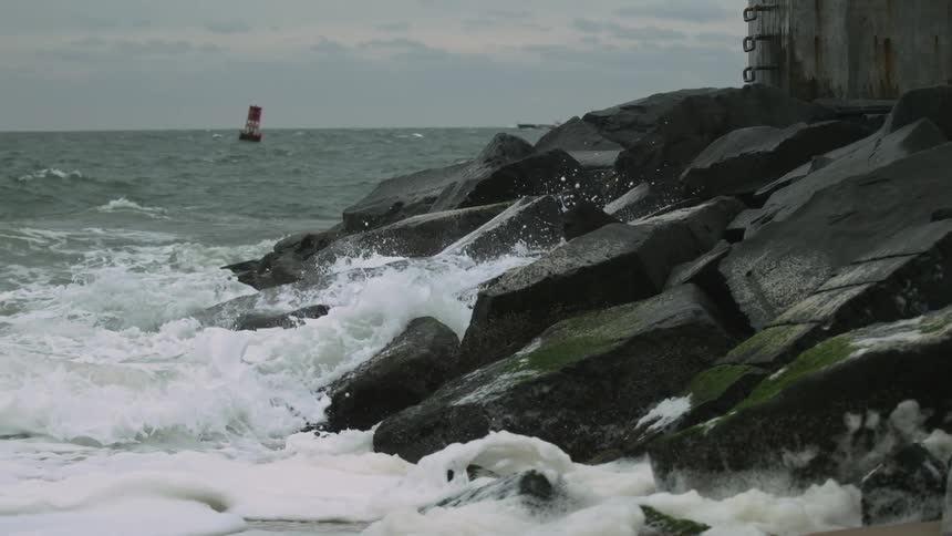 Waves crashing ashore in a rocky area