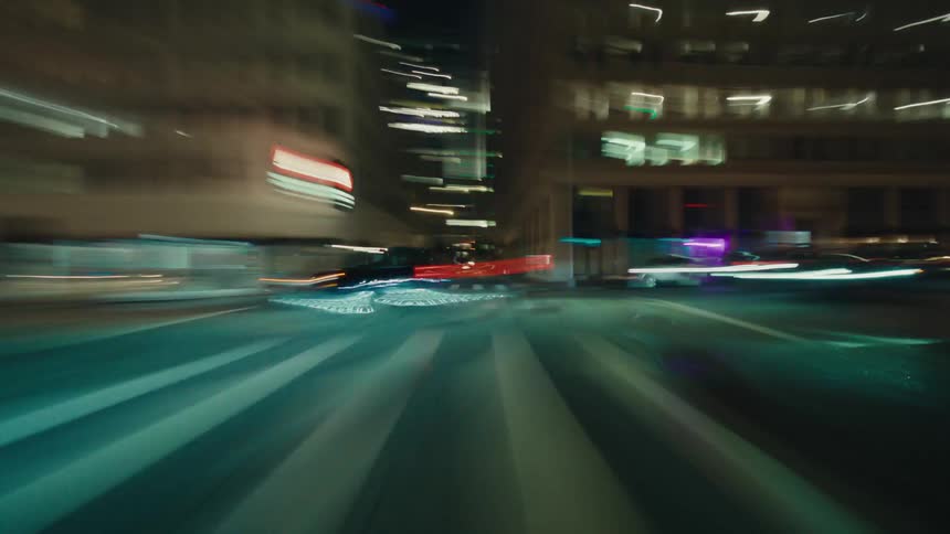Streets of a city lit up at night