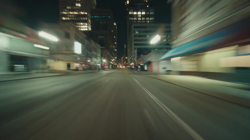 Speeding through a city at night