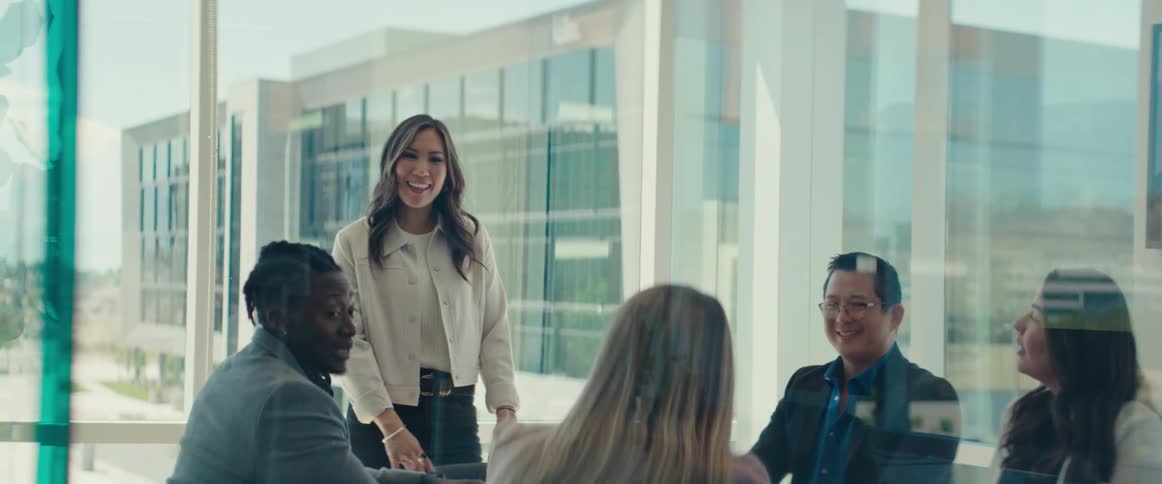A woman is talking at a meeting