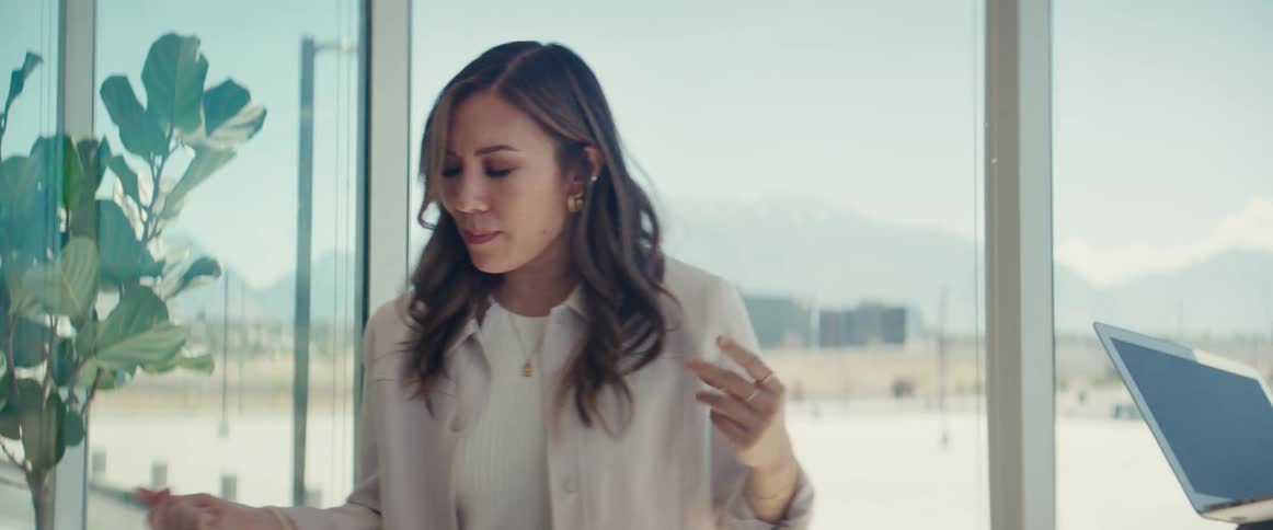 An asian woman and a black man collaborate in an office setting