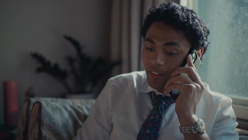 Man sitting talking on a phone call