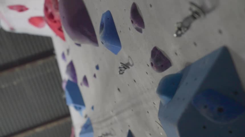 Close up of a rock climbing wall inside a facility