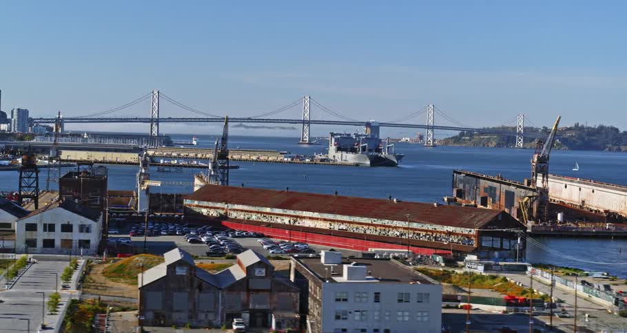 Aerial panorama of a port area with a metropolis in the background
