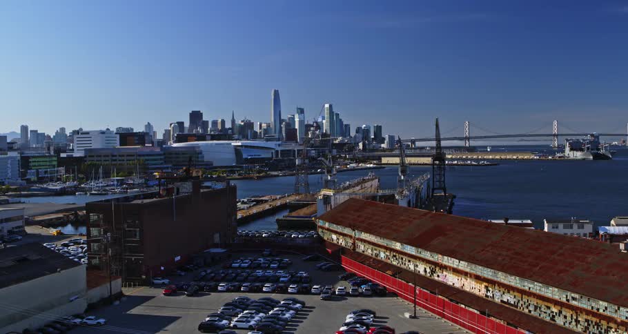 Aerial view of a port with a metropolis in the background