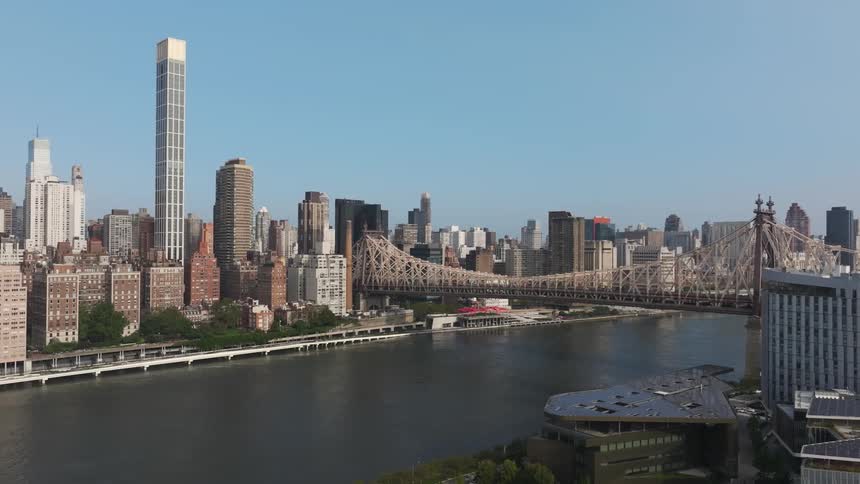 A large city next to a river with a bridge