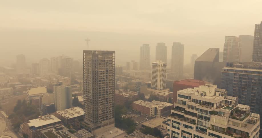 Choking wildfire smoke paints the city in a strange and hazy orange light