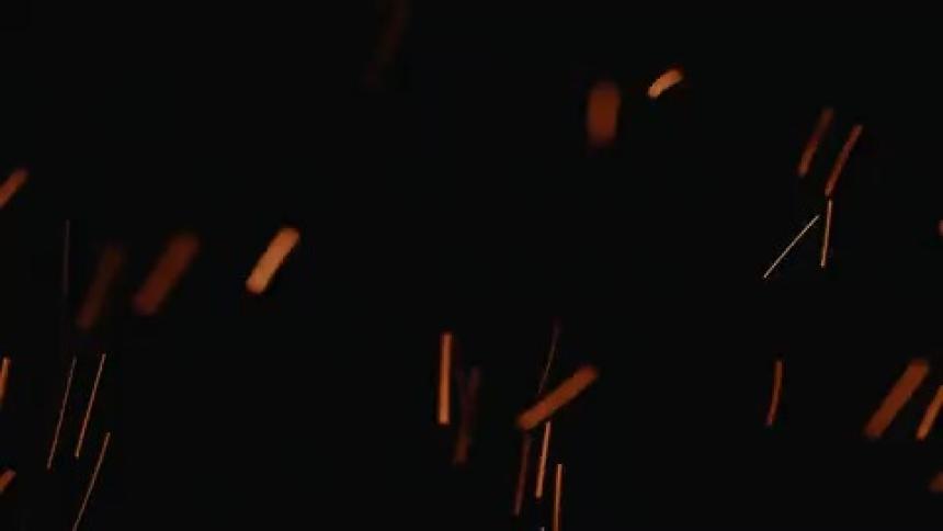 Fire sparks flying in the dark