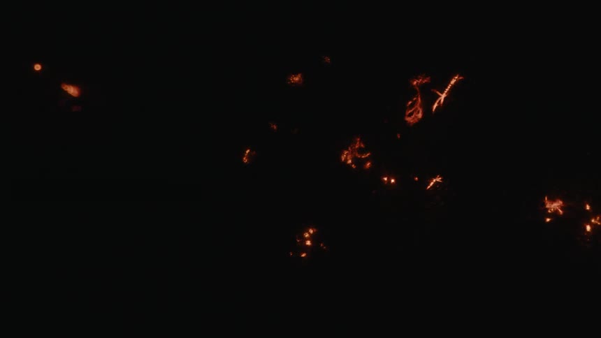 Abstract fire burning against a dark background