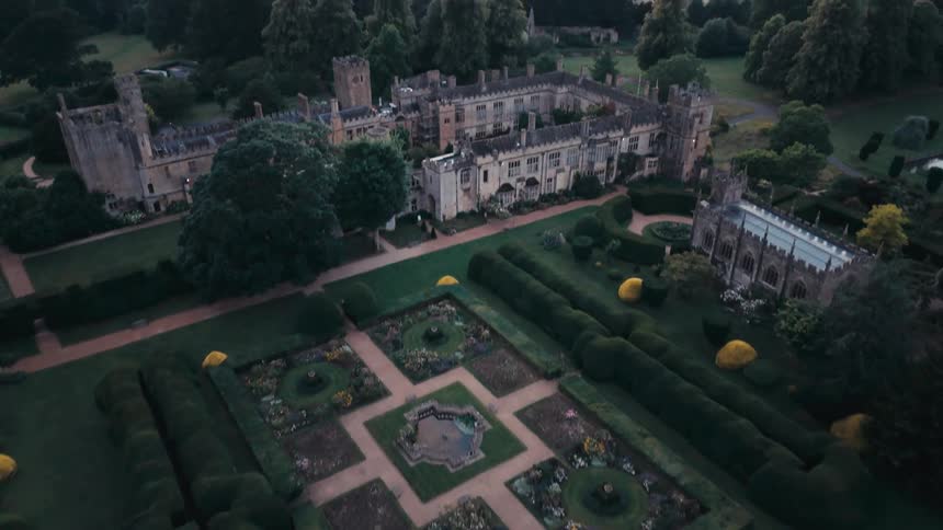 Aerial view of a medieval building surrounded by vegetation