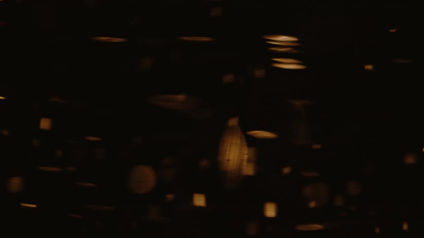 Abstract glowing liquid in rotating motion against a dark background