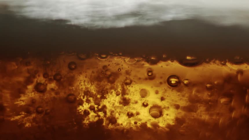 Bubble rise towards the surface of a fizzing and foaming beverage