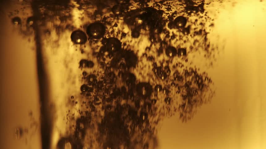 Beer is poured into the glass