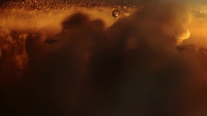 Abstract liquid in motion generating bubbles