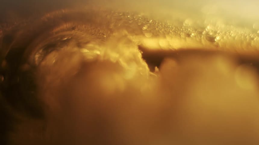 Extreme close up on abstract moving liquid
