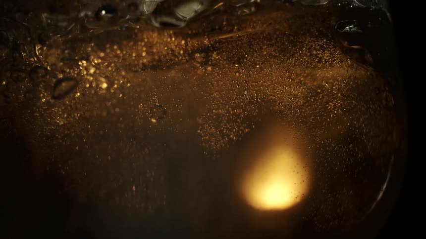 Beer twirling inside a glass
