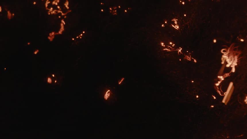 Fire burning abstract lines in a dark environment