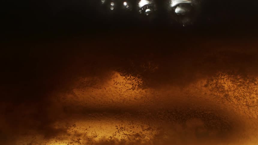 Foam moves in the beer