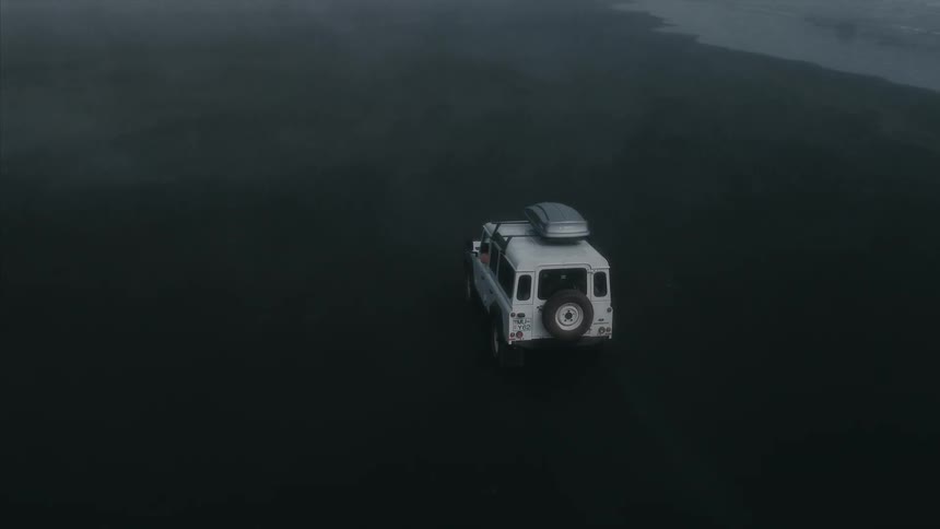 Jeep in the middle of foggy plains