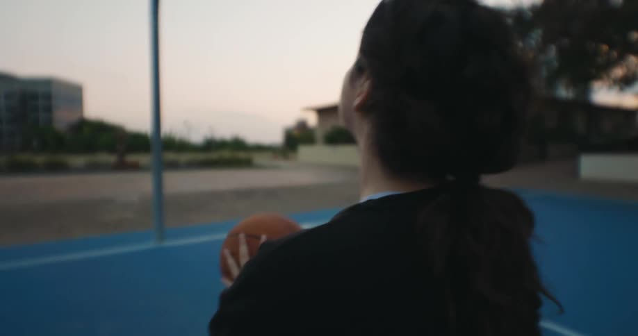 A clip of a female on a wheelchair playing basketball