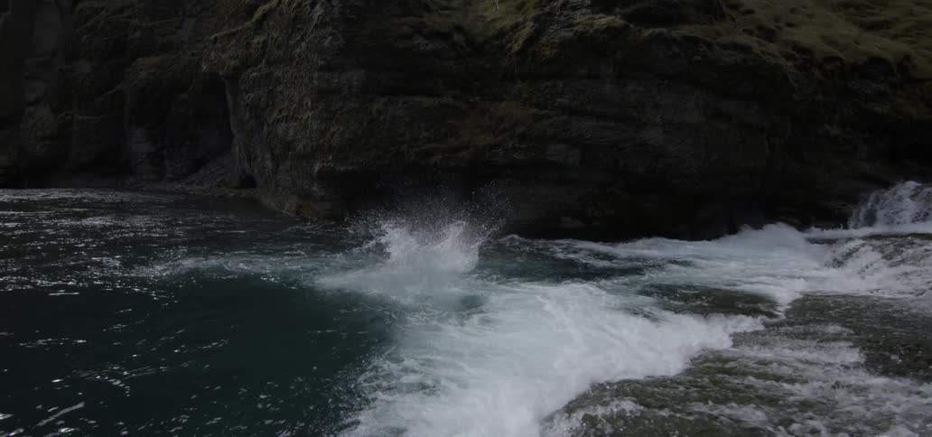 Person jumping up from up high into a river