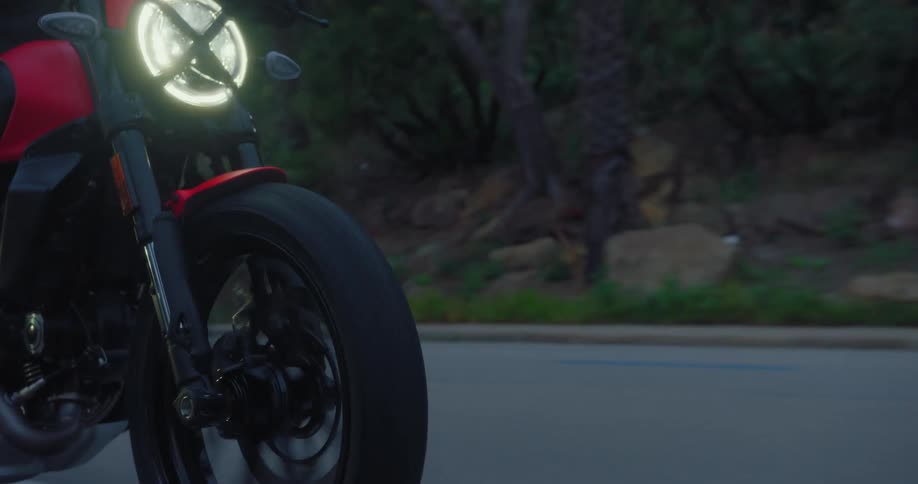 Men are riding their motorcycles on the road