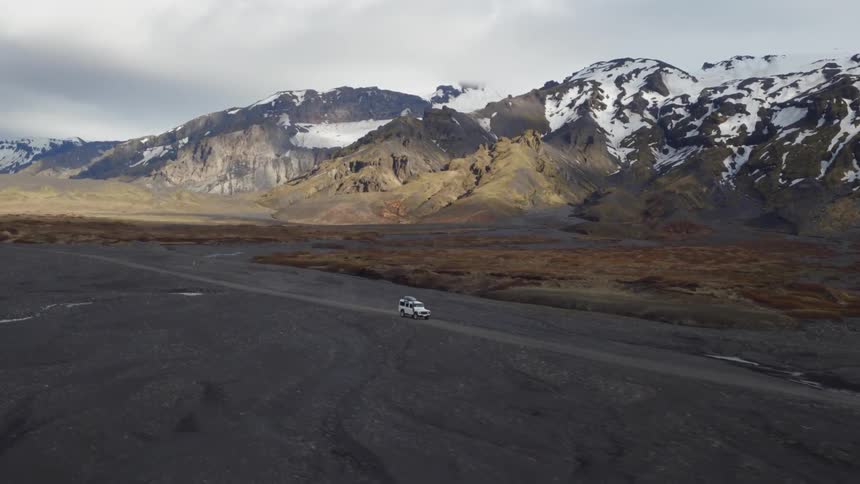 A vehicle drives off road in the mountains