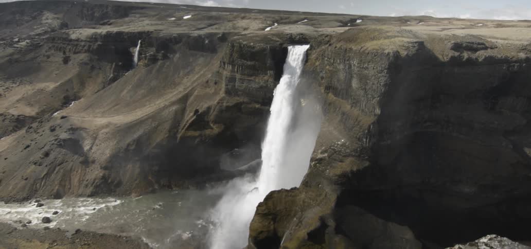 Waterfall splashing down into a river
