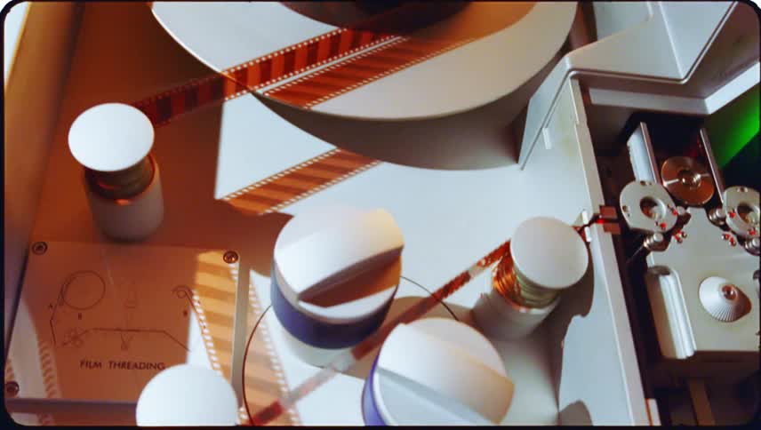 Film in a machine that is flashing being fed through rotators