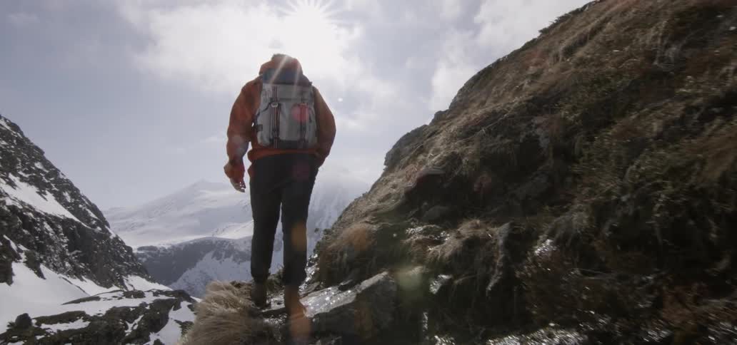 A man hiking in a mountainous environment