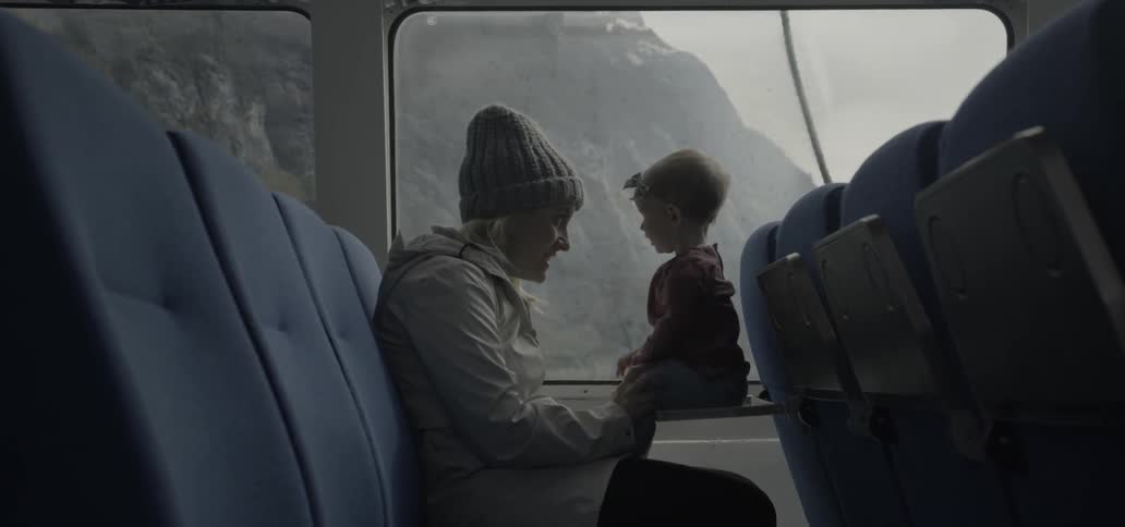 Woman entertaining her toddler on a commercial vehicle
