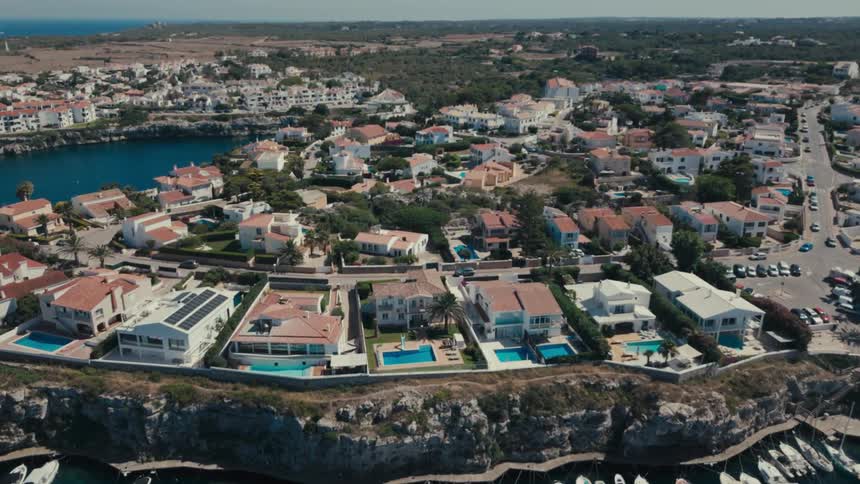 An aerial clip of a city beside the shore