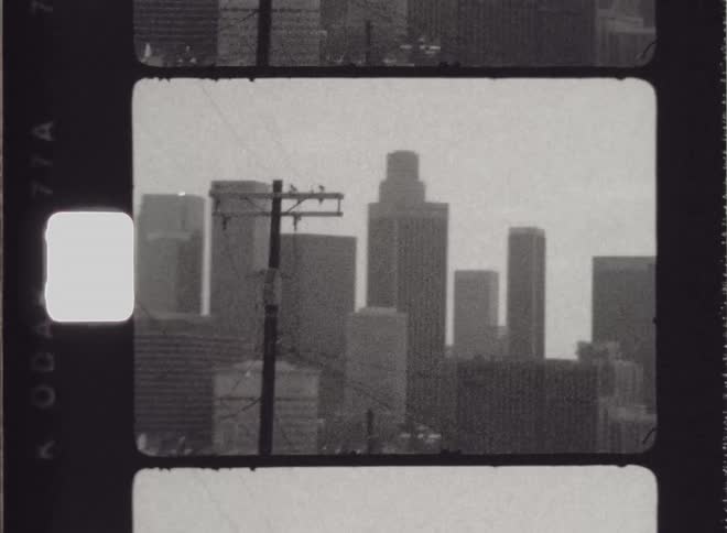 A black and white film clip of a city