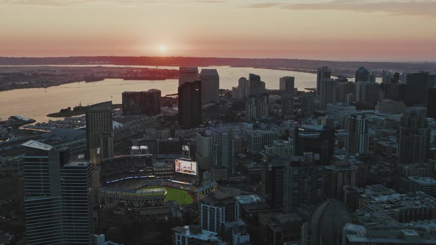 An evening aerial clip of an arena in the city