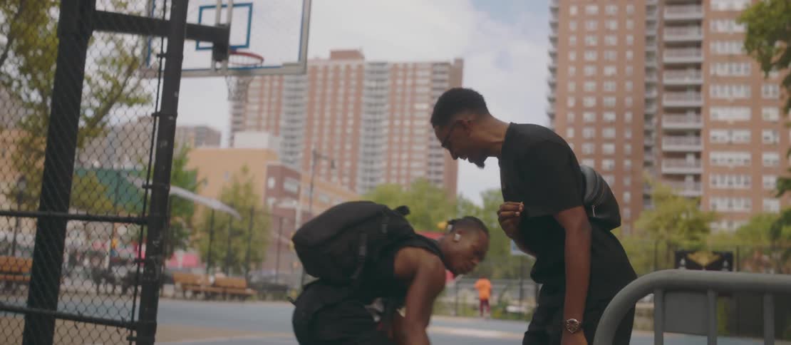 A clip of friends exchanging greetings at the basketball court