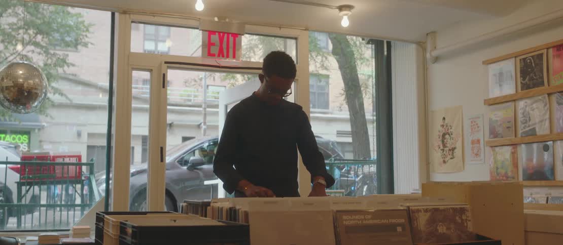 Male customer browses through the merchandise in a record store