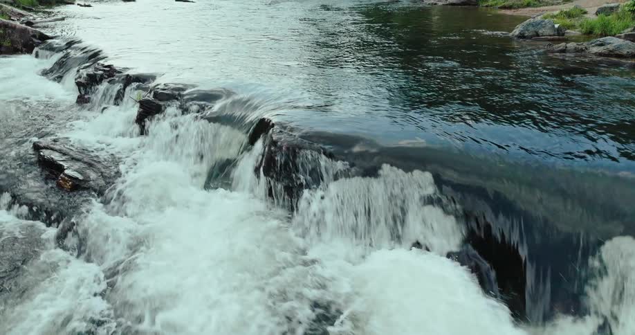 The rapids move over the ledge