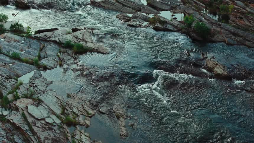 River flowing over a rocky bed with small rapids and pools