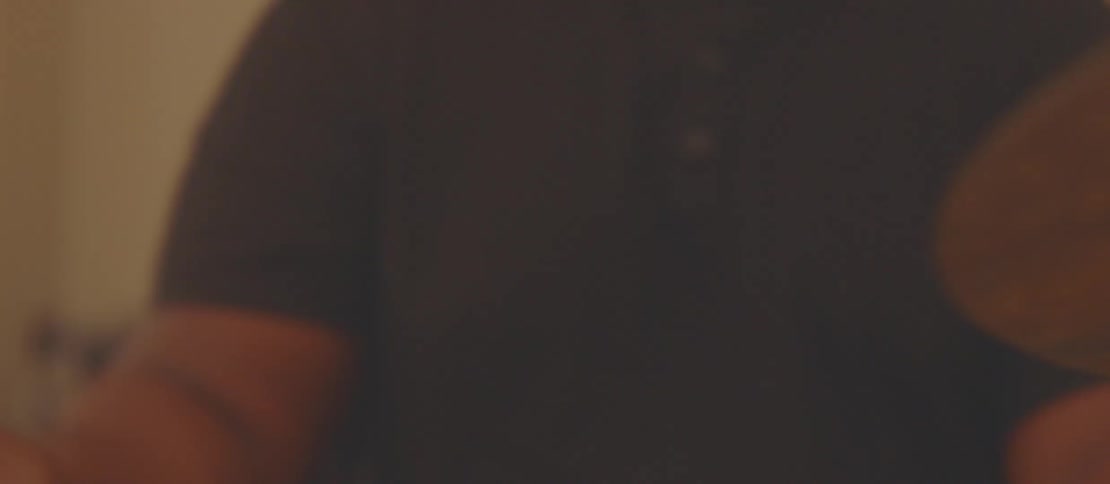Close up of a musician playing drums in a room