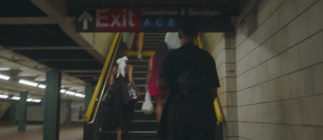 People climb the staircase leading from the underground subway station and to ground level