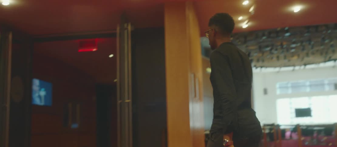 Young man walking into a club