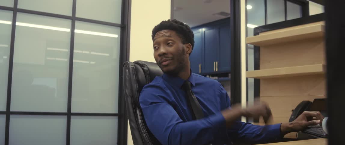 A clip of an employee working and having a conversation